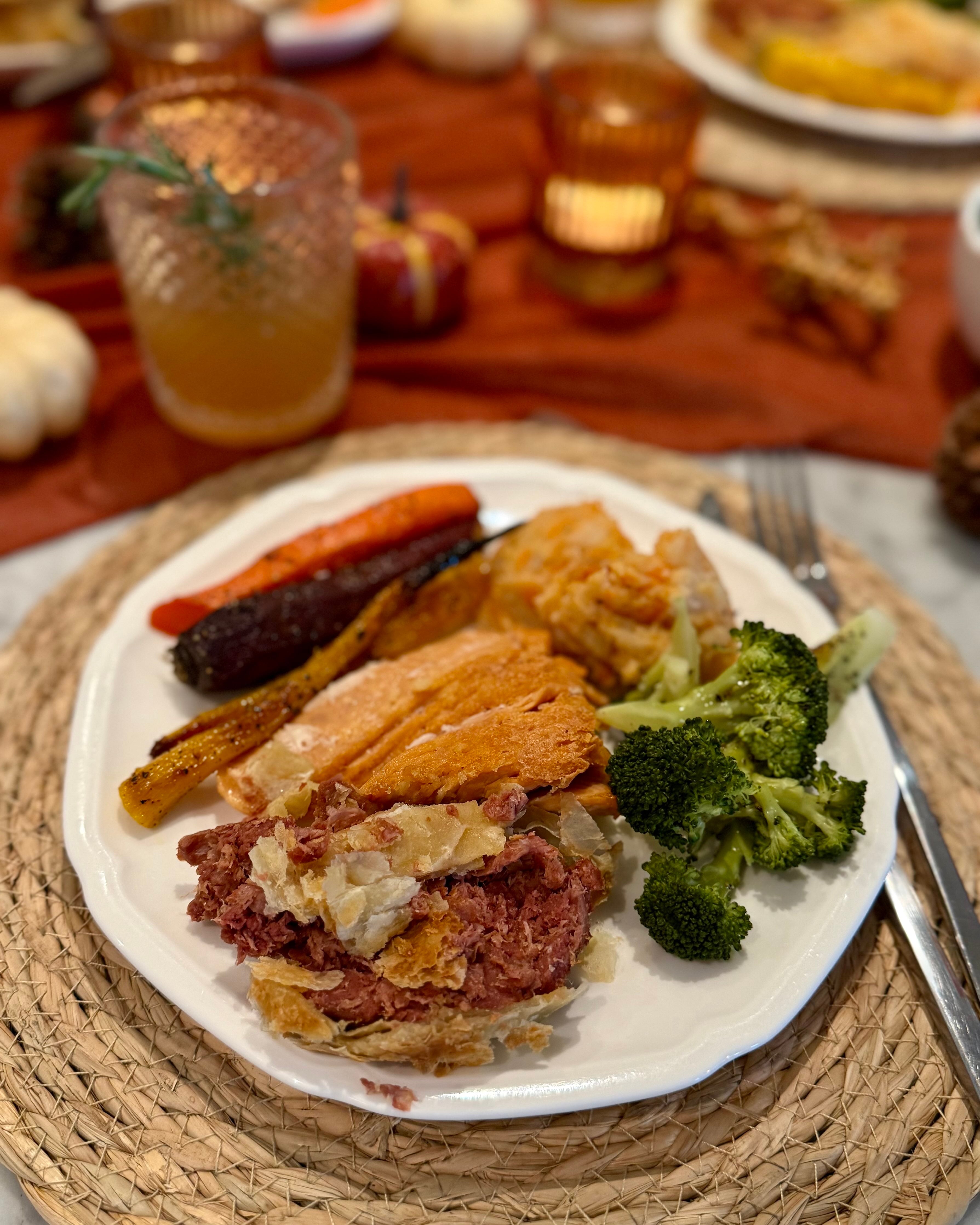 A loaded plate of plant-based meats and vegetables.