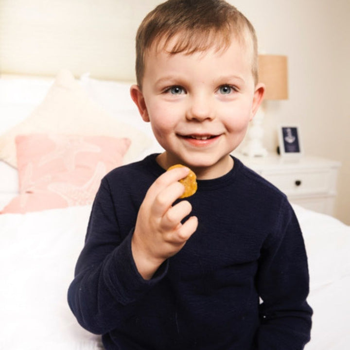 Boy enjoying Rule Breaker Snacks bites