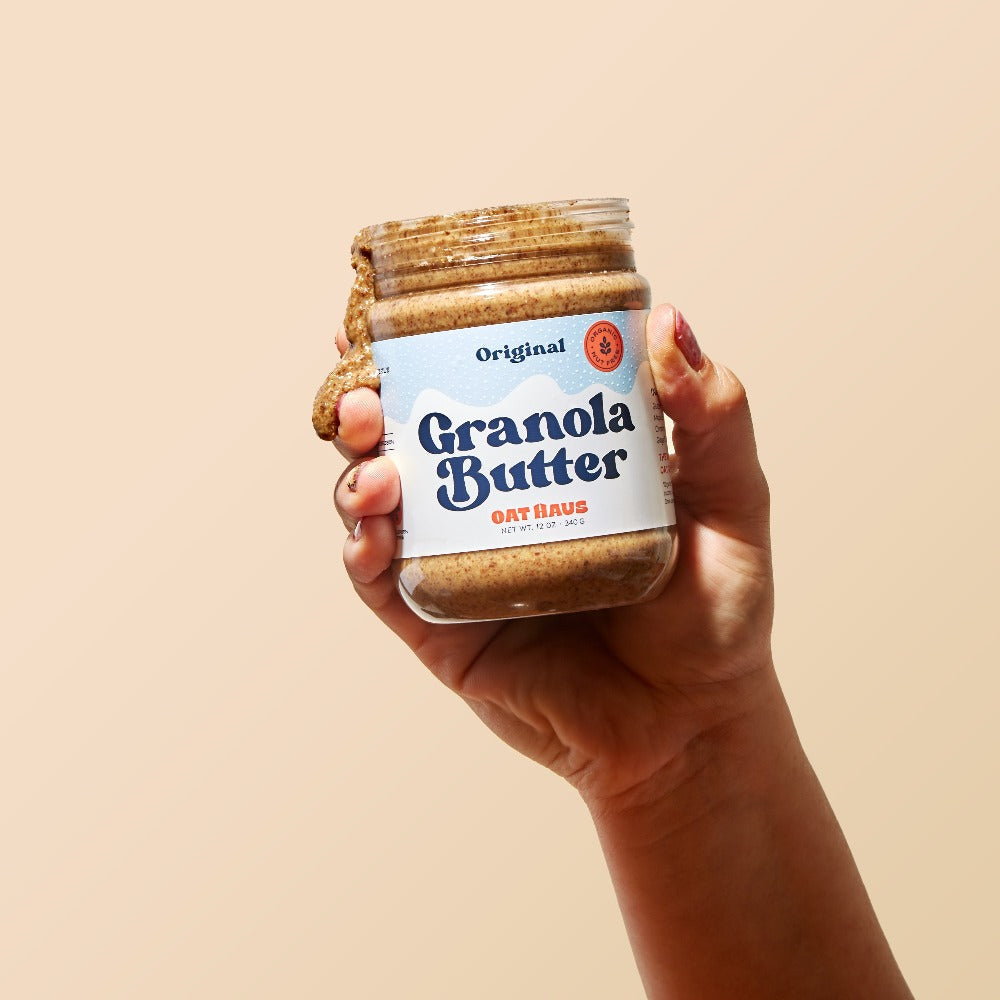 Hand Holding Original Granola Butter by Oat Haus