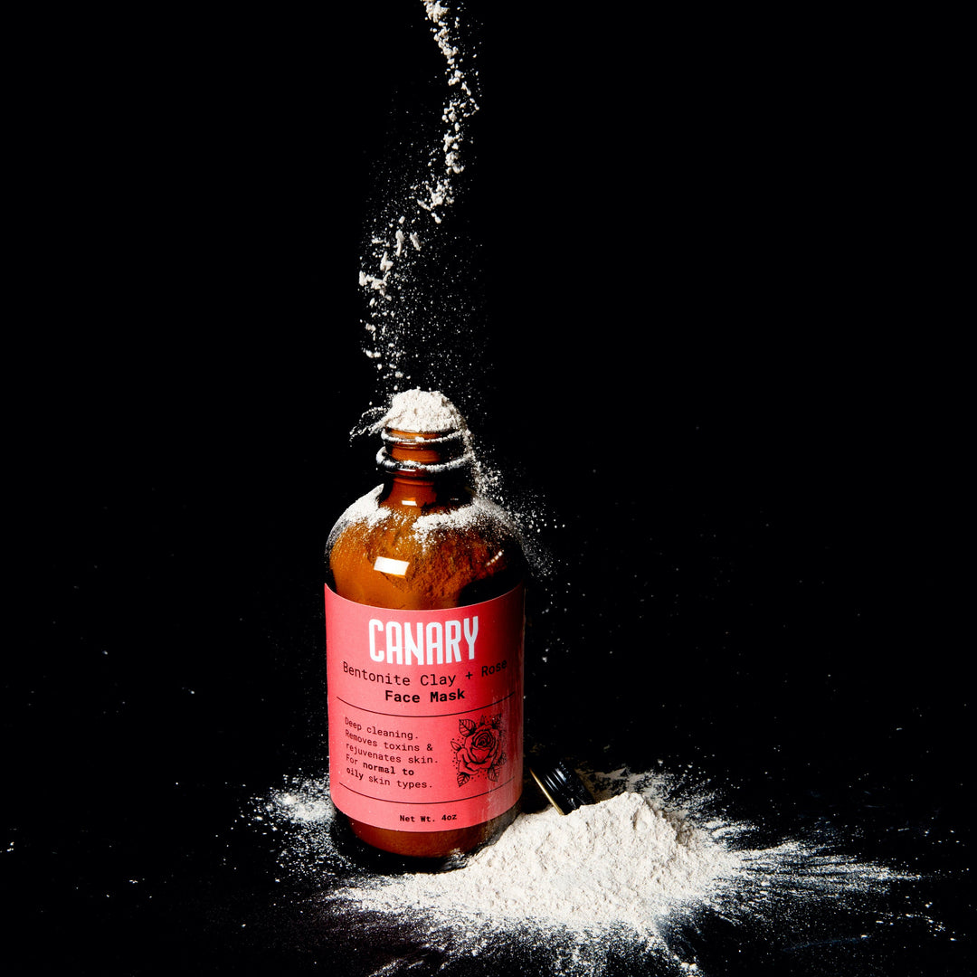 Canary Bentonite Clay + Rose Face Mask, view of the clay powder falling into the 4 ounce jar