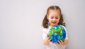 child with a globe